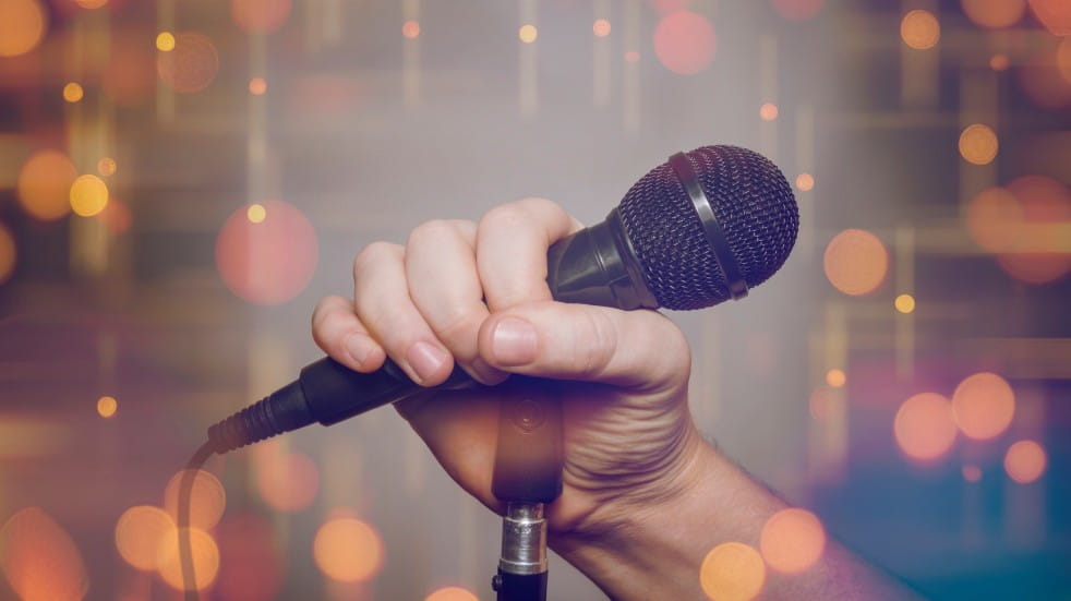 Free events in May 2021 hand holding microphone
